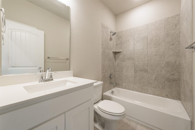 full bathroom with tiled shower / bath combo, vanity, and toilet