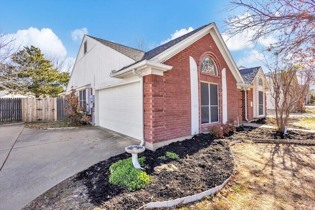 view of side of property with a garage