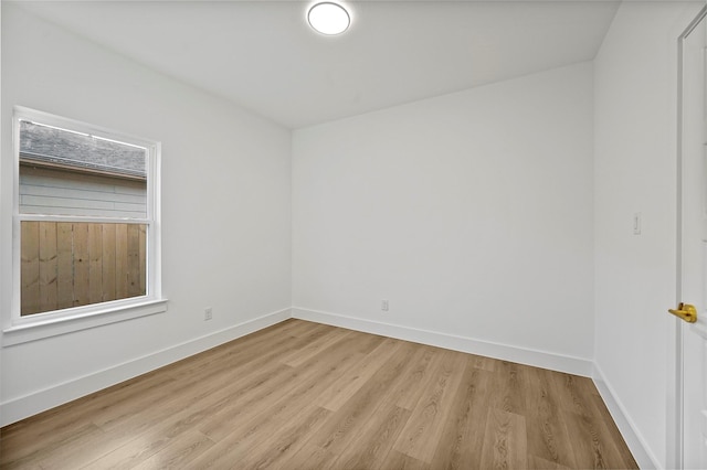 spare room with light hardwood / wood-style floors