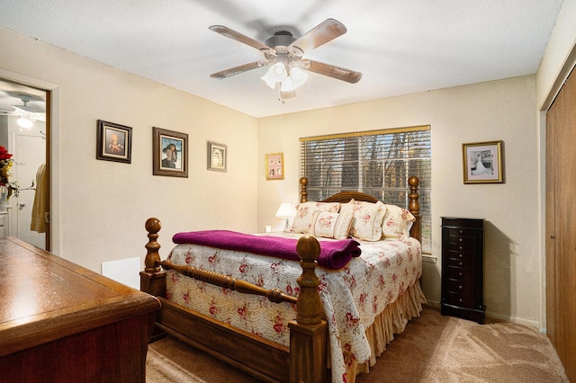 bedroom with ceiling fan, light colored carpet, and a closet