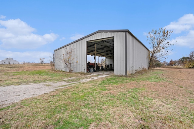 view of outdoor structure with a yard