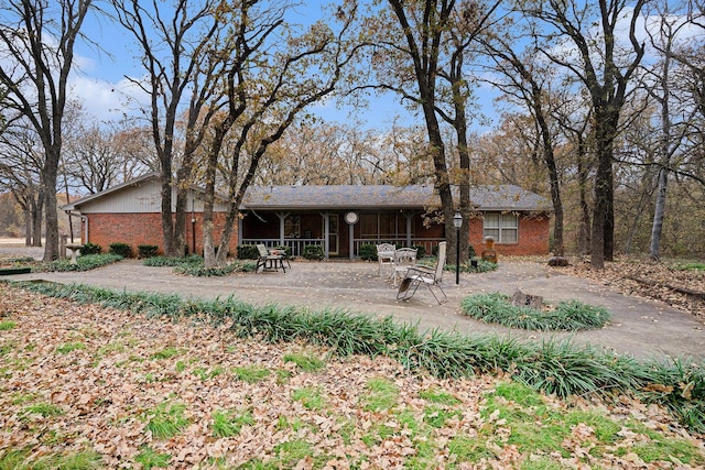 rear view of house featuring a patio