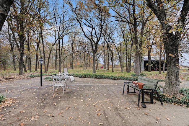 view of property's community featuring an outdoor structure