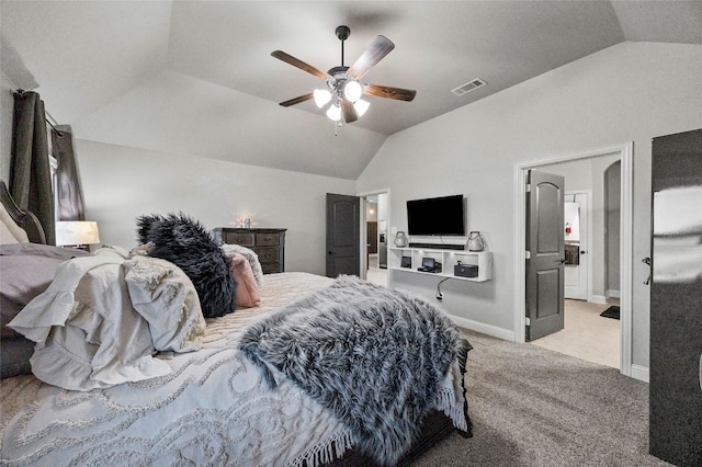 bedroom featuring vaulted ceiling, light colored carpet, and ceiling fan