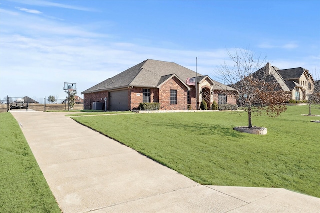 view of front of property with a garage and a front lawn