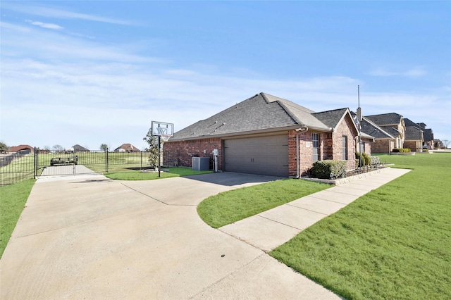 view of side of home featuring a garage and a yard