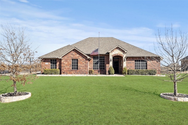 ranch-style house with a front lawn