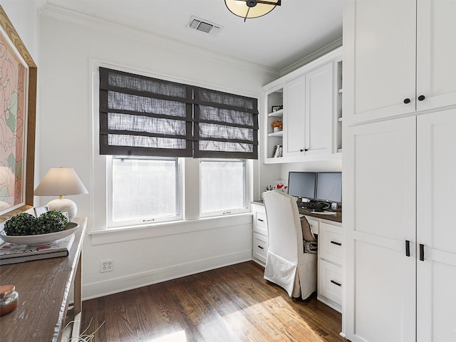 home office featuring crown molding, dark hardwood / wood-style flooring, and built in desk