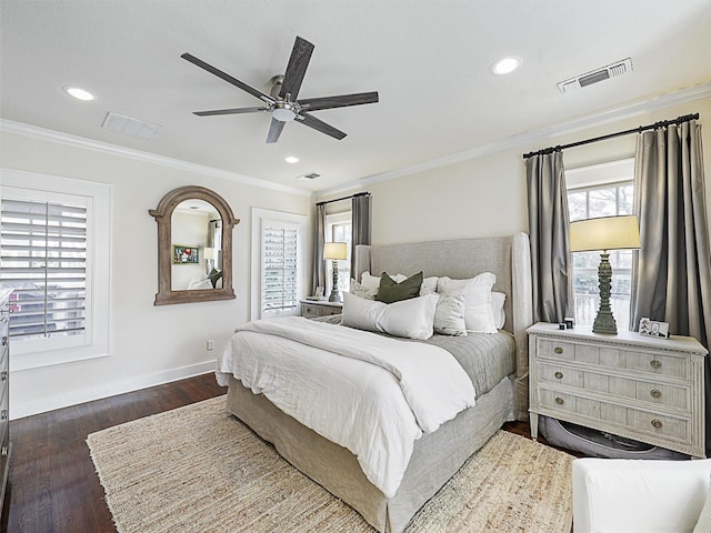 bedroom with dark wood-type flooring, ceiling fan, and ornamental molding