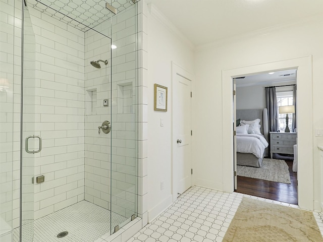 bathroom featuring crown molding and a shower with door