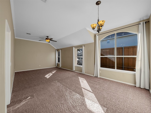 interior space featuring lofted ceiling, ceiling fan with notable chandelier, ornamental molding, and carpet