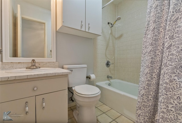 full bathroom with shower / tub combo with curtain, backsplash, vanity, toilet, and tile patterned floors