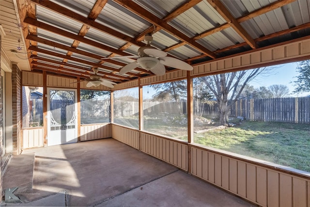 unfurnished sunroom featuring lofted ceiling and ceiling fan