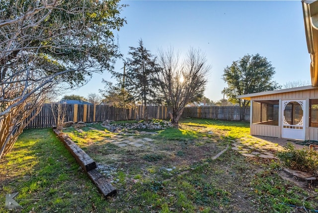 view of yard featuring a sunroom