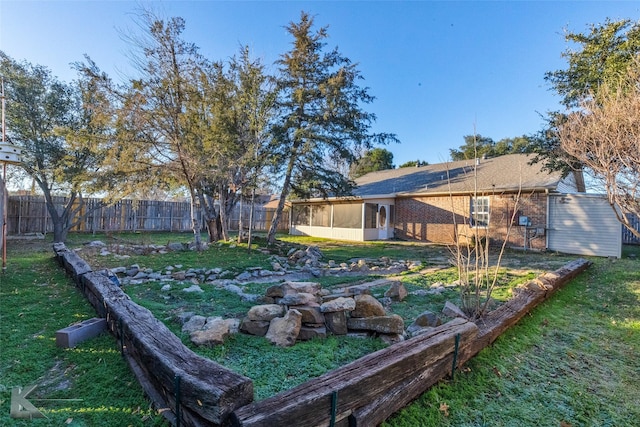 view of yard with a sunroom