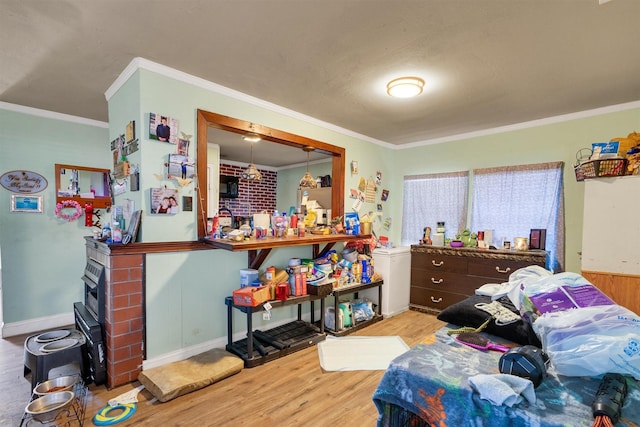 bedroom featuring ornamental molding and wood-type flooring