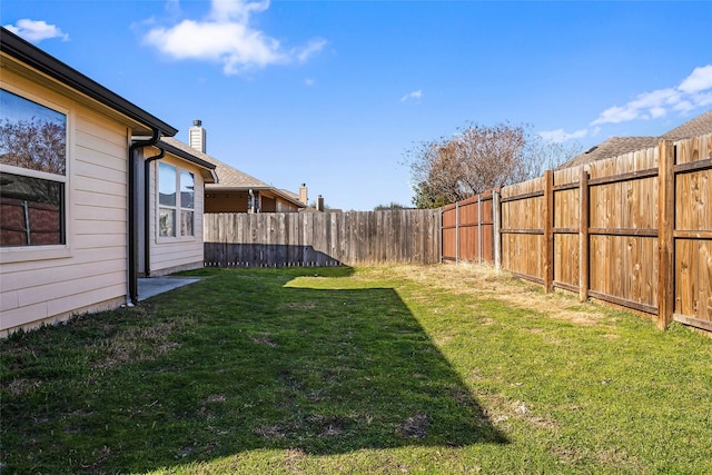 view of yard featuring a fenced backyard