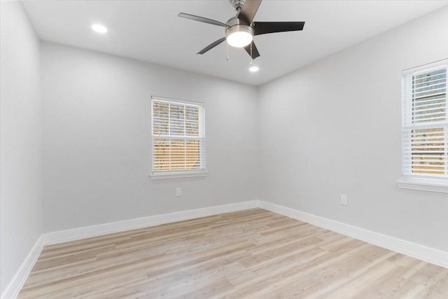 spare room with ceiling fan and light hardwood / wood-style floors