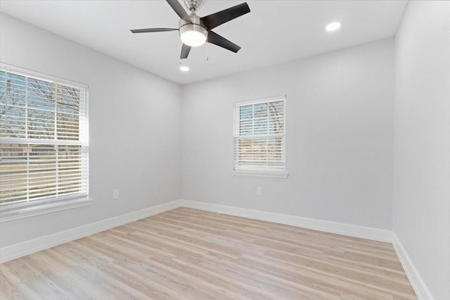 empty room with ceiling fan and light wood-type flooring