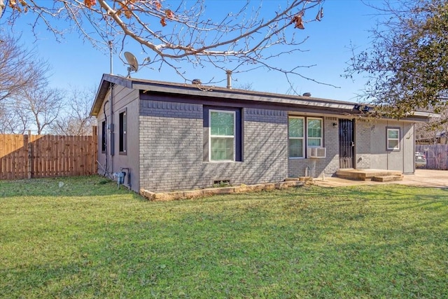 ranch-style house with a front lawn