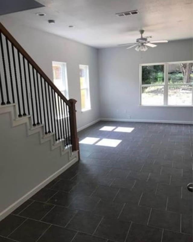 unfurnished room featuring ceiling fan