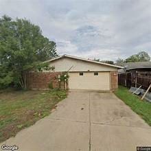 view of property exterior featuring a garage