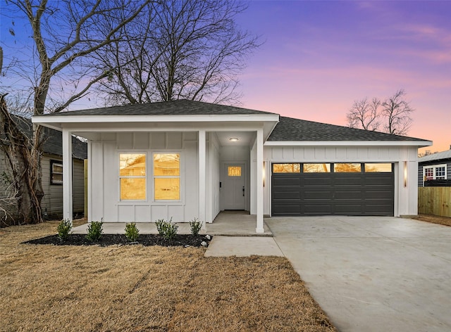 view of front of house featuring a yard and a garage