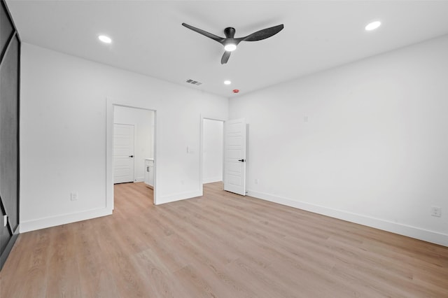 unfurnished bedroom with ceiling fan and light hardwood / wood-style floors