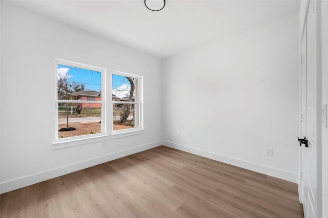 spare room featuring light hardwood / wood-style flooring