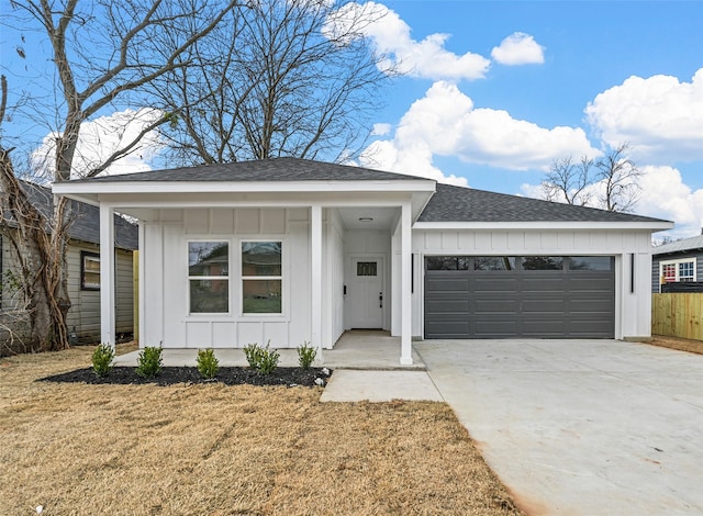 view of front of home with a garage and a front yard