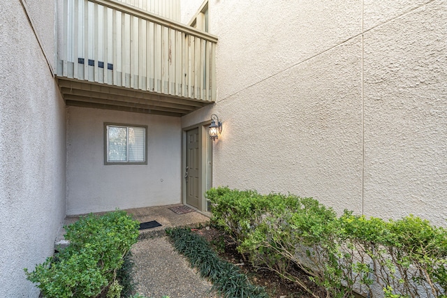 property entrance with a balcony