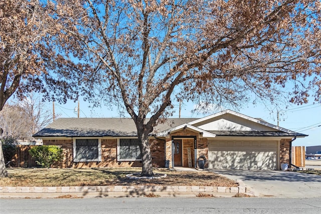 ranch-style home featuring a garage