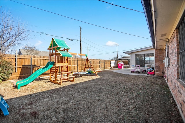 view of playground featuring a patio area