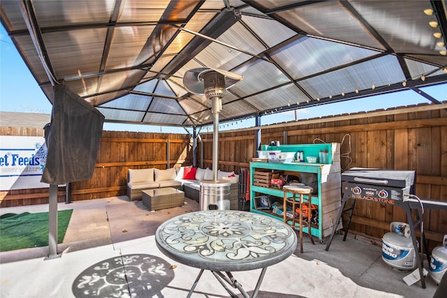 view of patio with a gazebo and an outdoor hangout area