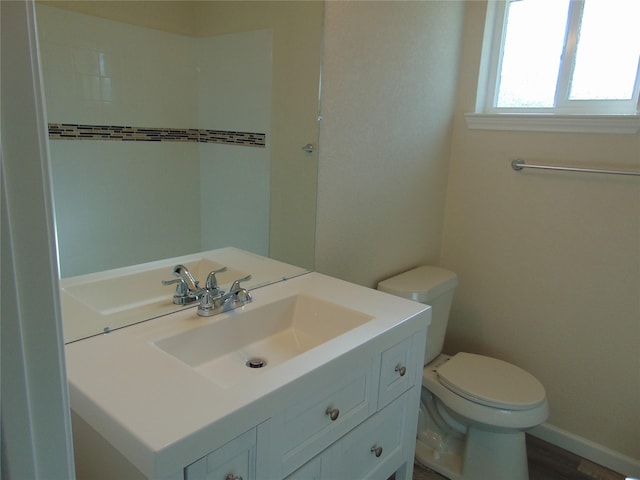 bathroom featuring vanity, toilet, and wood-type flooring