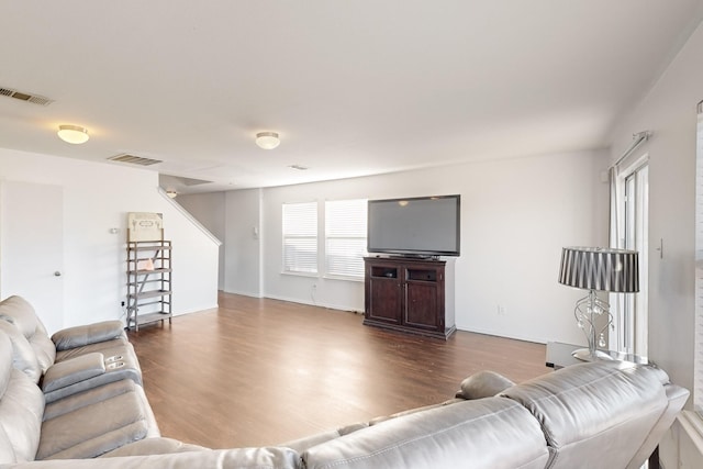 living room featuring dark wood-type flooring