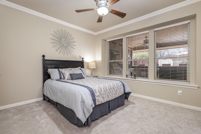 bedroom featuring crown molding, light colored carpet, and ceiling fan