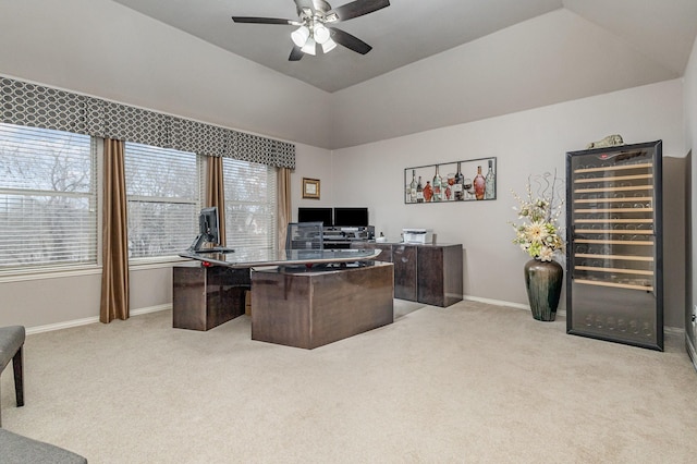 home office featuring light carpet, vaulted ceiling, beverage cooler, and ceiling fan