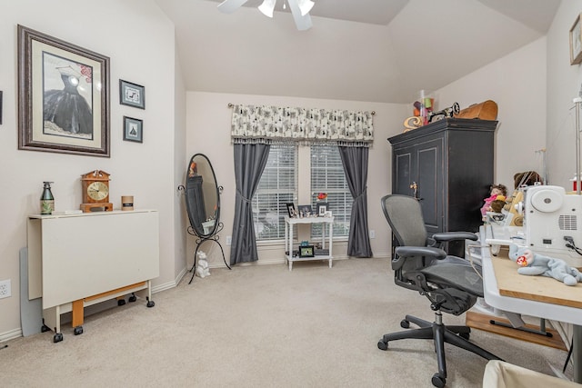 carpeted home office featuring ceiling fan and lofted ceiling