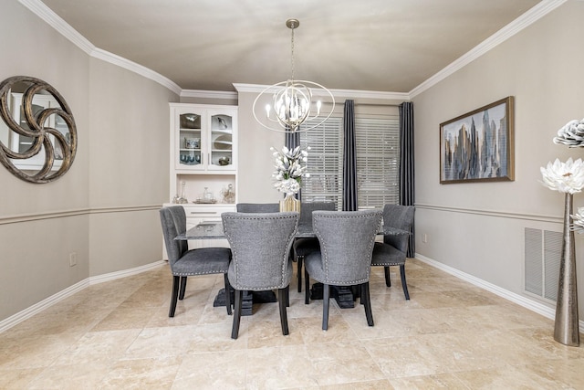 dining room featuring ornamental molding and a chandelier