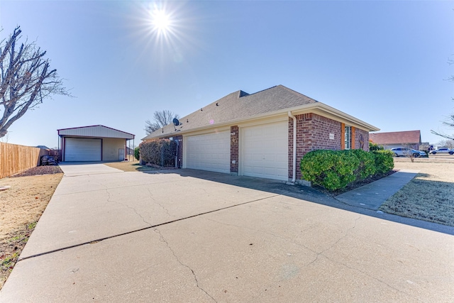 view of side of home with a garage