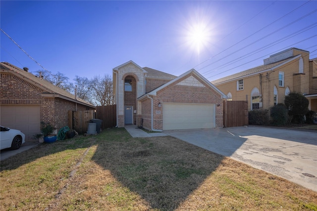 view of front of property with a garage and a front lawn