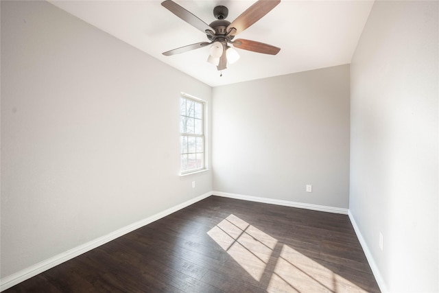 spare room featuring dark hardwood / wood-style flooring and ceiling fan