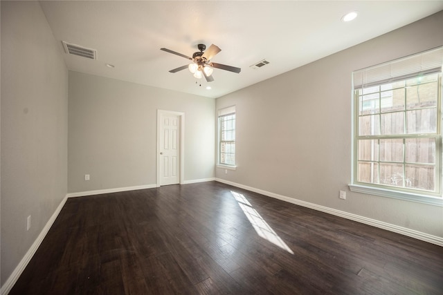 empty room featuring ceiling fan and dark hardwood / wood-style floors