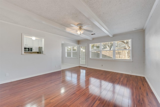 unfurnished living room featuring beamed ceiling, ceiling fan, hardwood / wood-style floors, and a textured ceiling