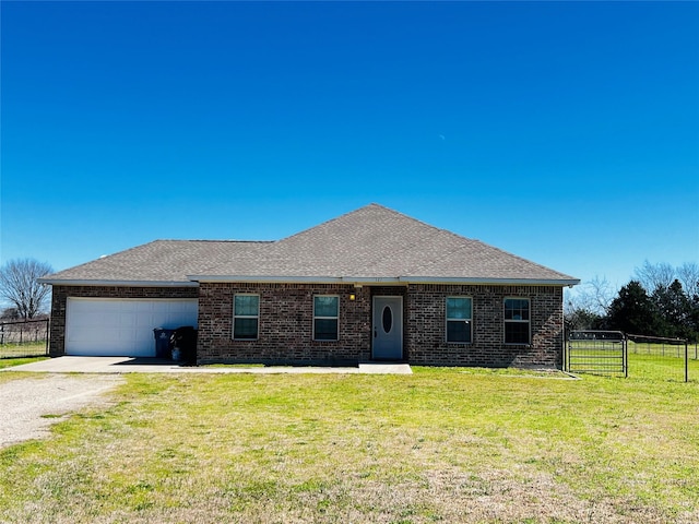 ranch-style home featuring an attached garage, gravel driveway, fence, a front yard, and brick siding