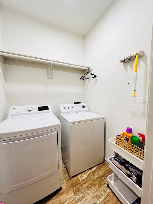 laundry room with laundry area and separate washer and dryer