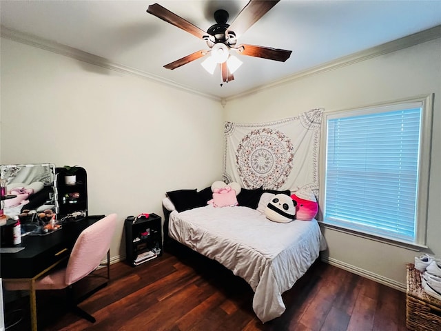 bedroom with ornamental molding, wood finished floors, and baseboards