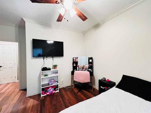 bedroom with ceiling fan, wood finished floors, and crown molding