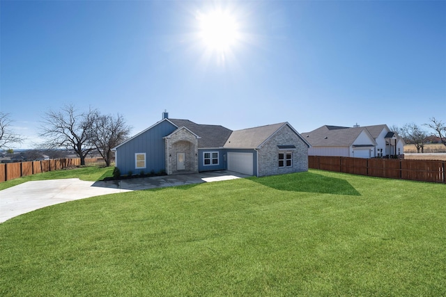 single story home featuring a garage and a front lawn